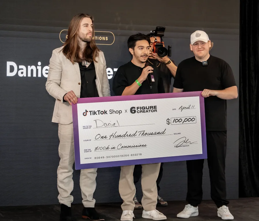 A 6FC member presented with a $100,000 TikTok Shop commission check